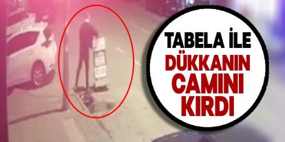 Bursa'da Şok Olay: Yolda Aldığı Reklam Tabela İle İş Yerinin Camını Kırdı!